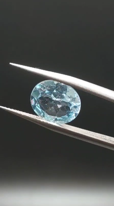 4.95ct 12x10mm Oval Natural Sky Blue Topaz