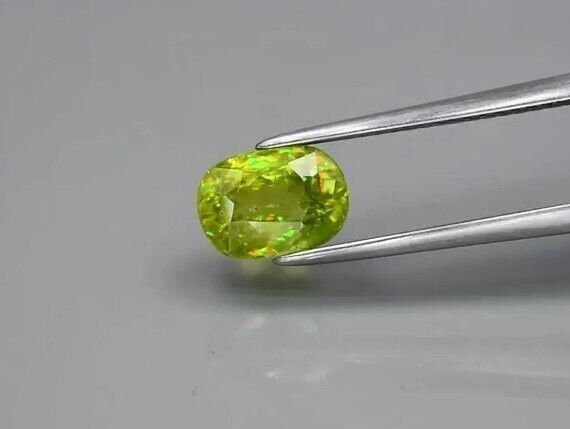 2.20ct 8x5.7mm Oval Natural Yellowish Green Sphene Madagascar, Amazing Luster