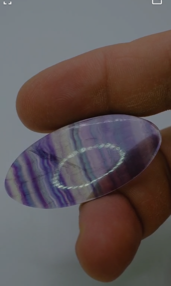 54.05ct 46.1x22.1mm Oval Cabachon Natural Multi-Color Fluorite