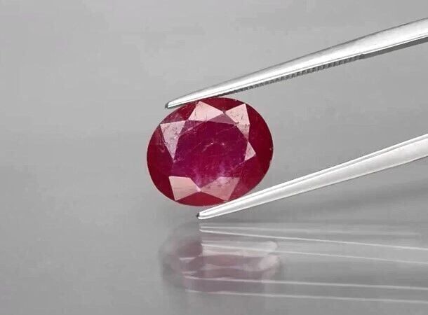 5.24ct 11.7x9.7mm Oval Purplish Red Ruby Gemstone (Heated Glass Filling)
