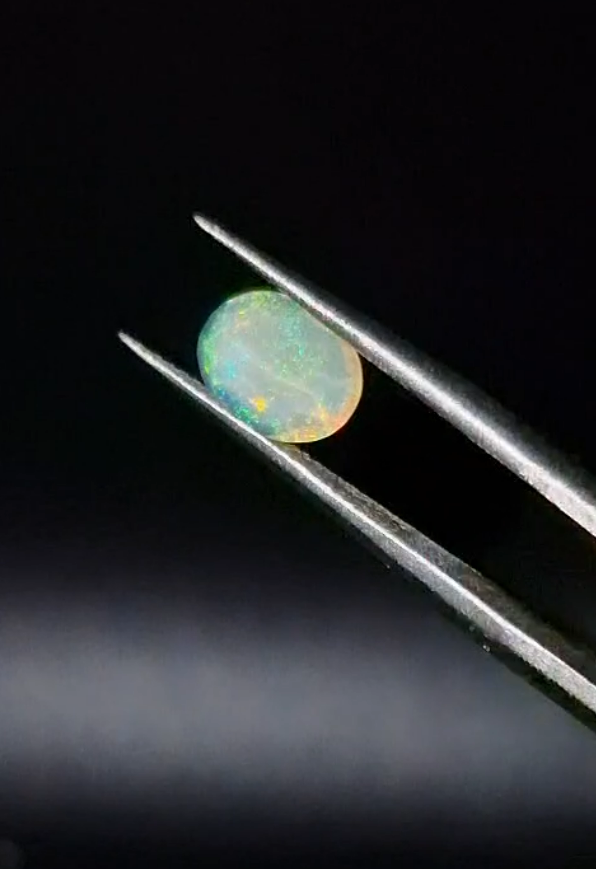 0.72ct  7.9x6.2mm Oval Natural Faceted Ethiopian Opal