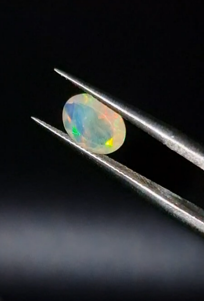 0.65ct  7.9x6.1mm Oval Natural Faceted Ethiopian Opal