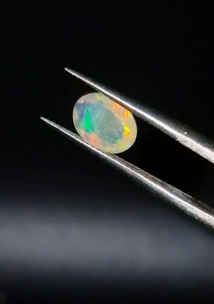 0.65ct  7.9x6.1mm Oval Natural Faceted Ethiopian Opal