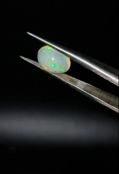 1.22ct  9x6.8mm Oval Natural Cabachon Ethiopian Opal