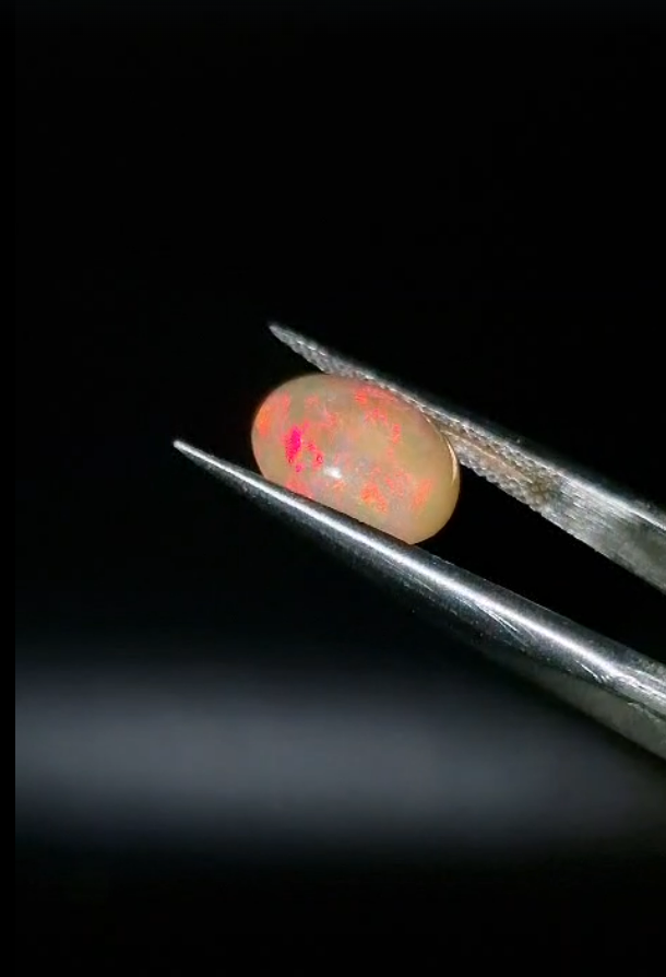 1.29ct  10.3x7.9mm Oval Natural Cabachon Ethiopian Opal