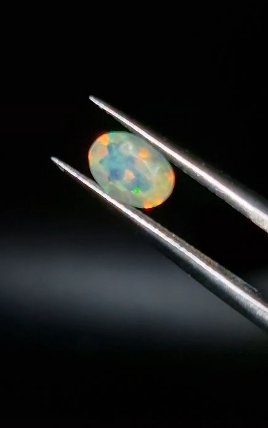 0.58ct 7.1x5.1mm Oval Natural Faceted Ethiopian Opal