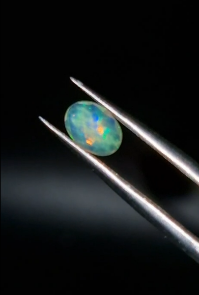 0.58ct 7.1x5.1mm Oval Natural Faceted Ethiopian Opal