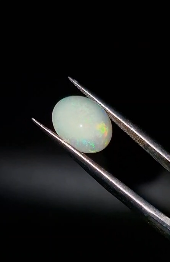 1.62ct 9.9x8mm Oval Natural Cabachon Ethiopian Opal