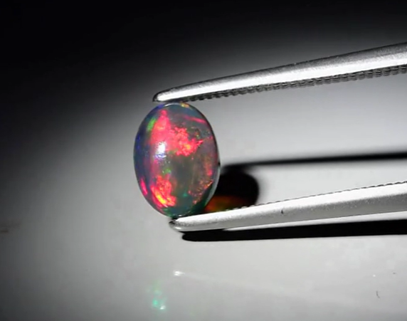 0.44ct 7x5mm Oval Cab Natural Floral Flash Play-Of-Color Crystal Black Opal
