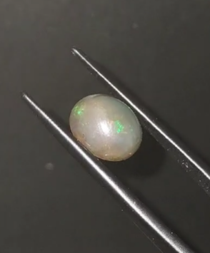 2.65ct 10.6x8.8mm Oval Cabachon Ethiopia Black Opal