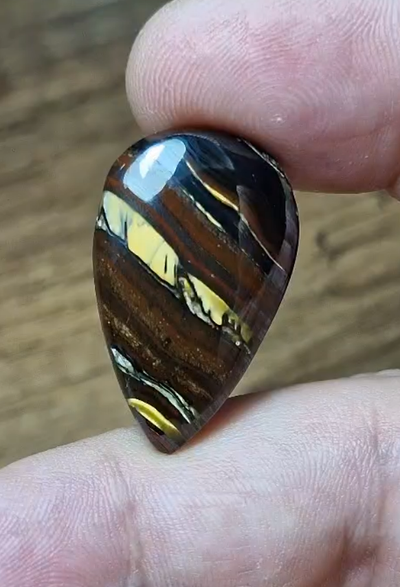 28.10ct 29.3x17.9mm Pear Natural Bi Color Tiger Eye