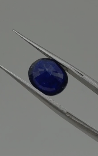 4.95ct 10.4x8.6mm Oval Natural  Sapphire ( Heated Glass Filling)